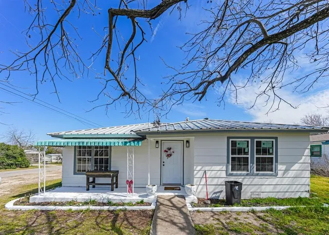 front view of a house with a patio