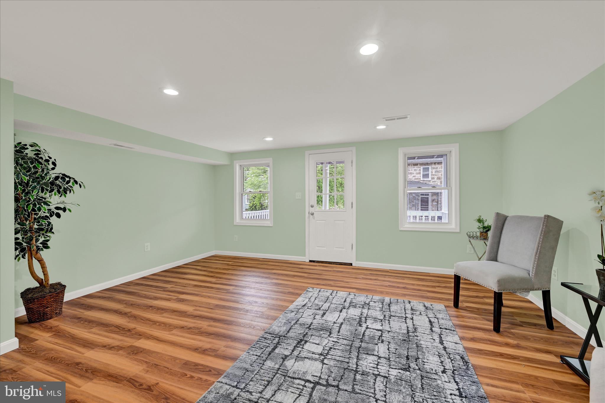 8511 Frederick Road Ellicott City, MD 21043 - Photo 12 of 36 a bedroom with a bed and a chair