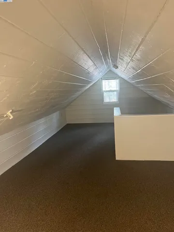 a bathroom with a shower and a glass door