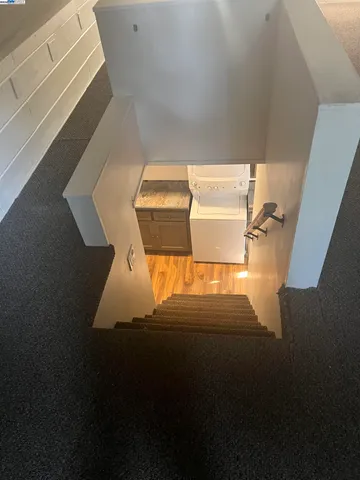 a view of a door of the house with a yard