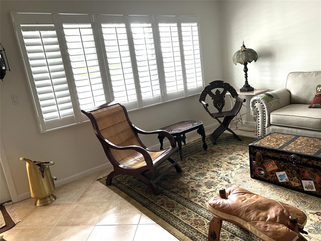 2057 Cambridge C, Unit 2057 Deerfield Beach, FL 33442 - Photo 6 of 29 LIVINGROOM with WINDOW SHUTTERS