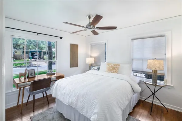a bedroom with a bed and a table