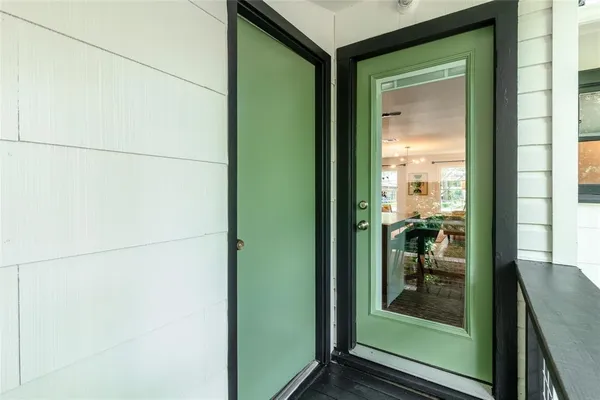 a view of a glass door and a living room
