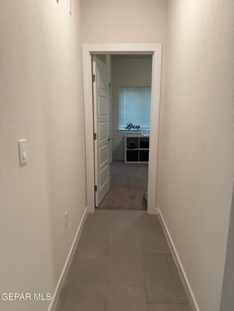 a bathroom with a sink a toilet and a shower curtain