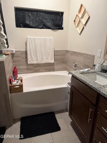 a bathroom with a shower and a glass door
