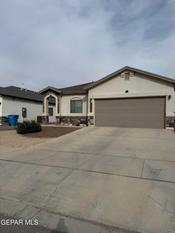 a front view of a house with a garage