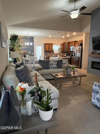 a living room with lots of furniture and a chandelier