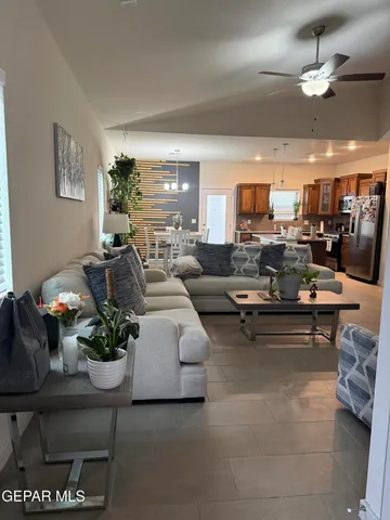 a living room with furniture and a large window