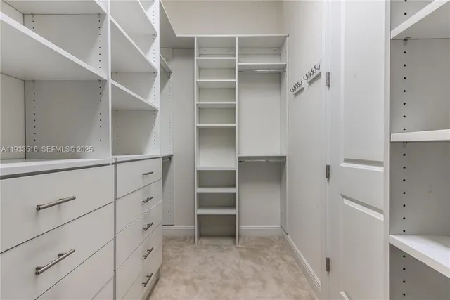a view of an empty walk in closet