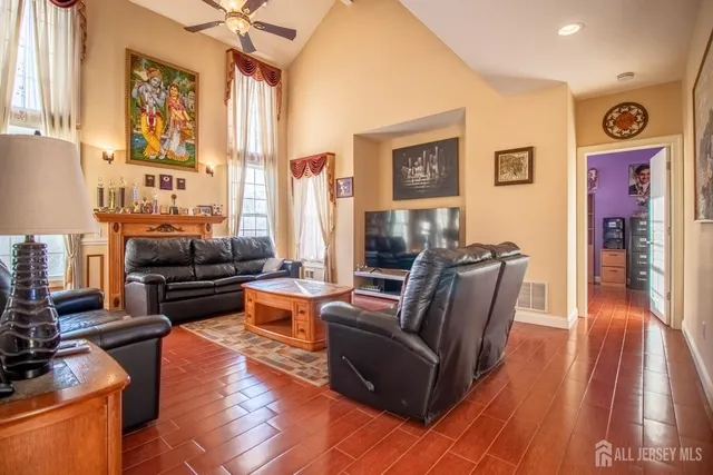 a living room with furniture and a fireplace