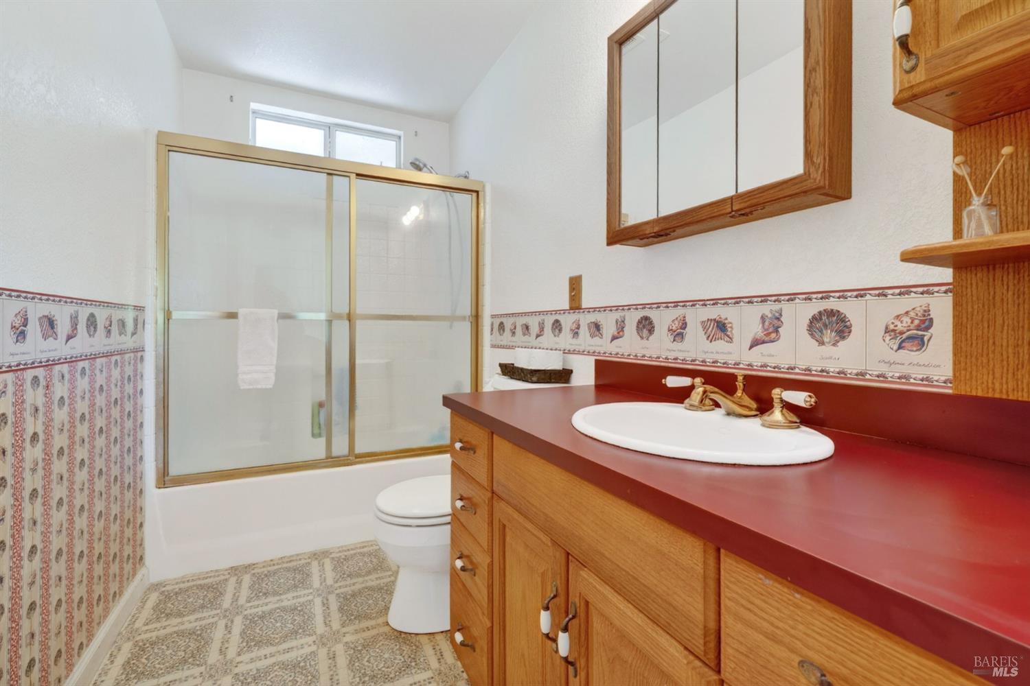 810 McNab Ranch Road Ukiah, CA 95482 - Photo 18 of 32 a bathroom with a sink toilet and shower