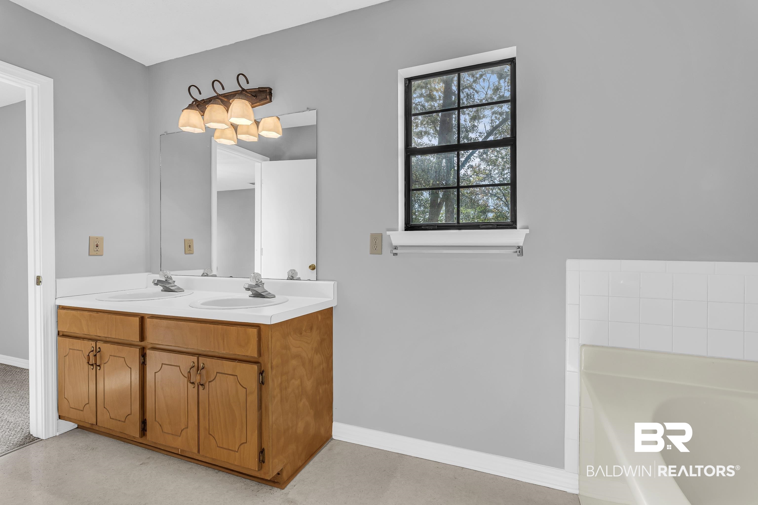 7787 Bellingrath Road Theodore, AL 36582 - Photo 27 of 36 Bathroom featuring a bath and double vanity