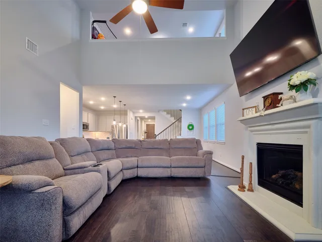 a living room with furniture and a fireplace