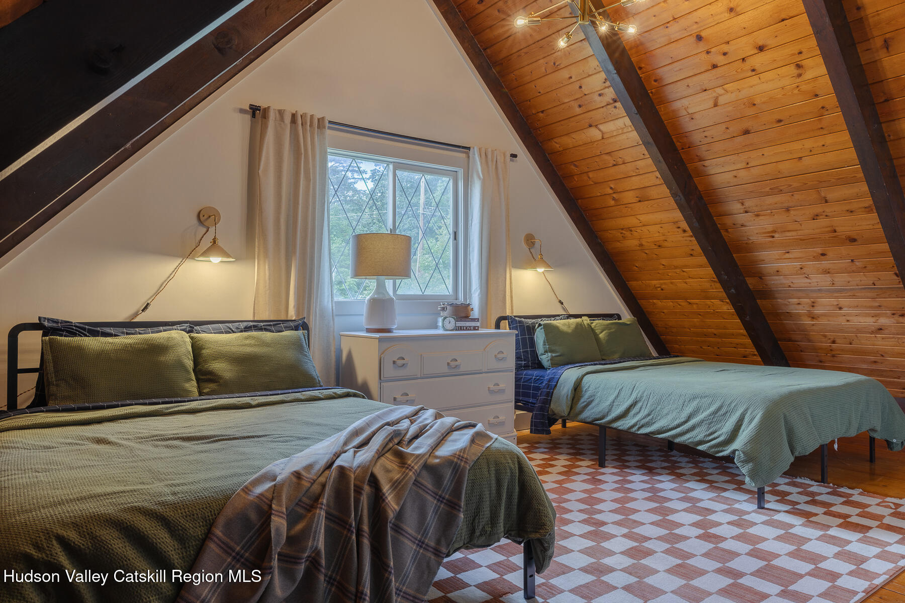 38 Cambridge Heights Road Windham, NY 12496 - Photo 17 of 29 a bedroom with a large bed and a wooden floor