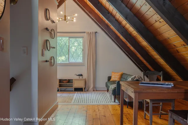 a bedroom with furniture and a window