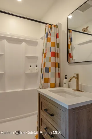 a bathroom with a sink and a bathtub