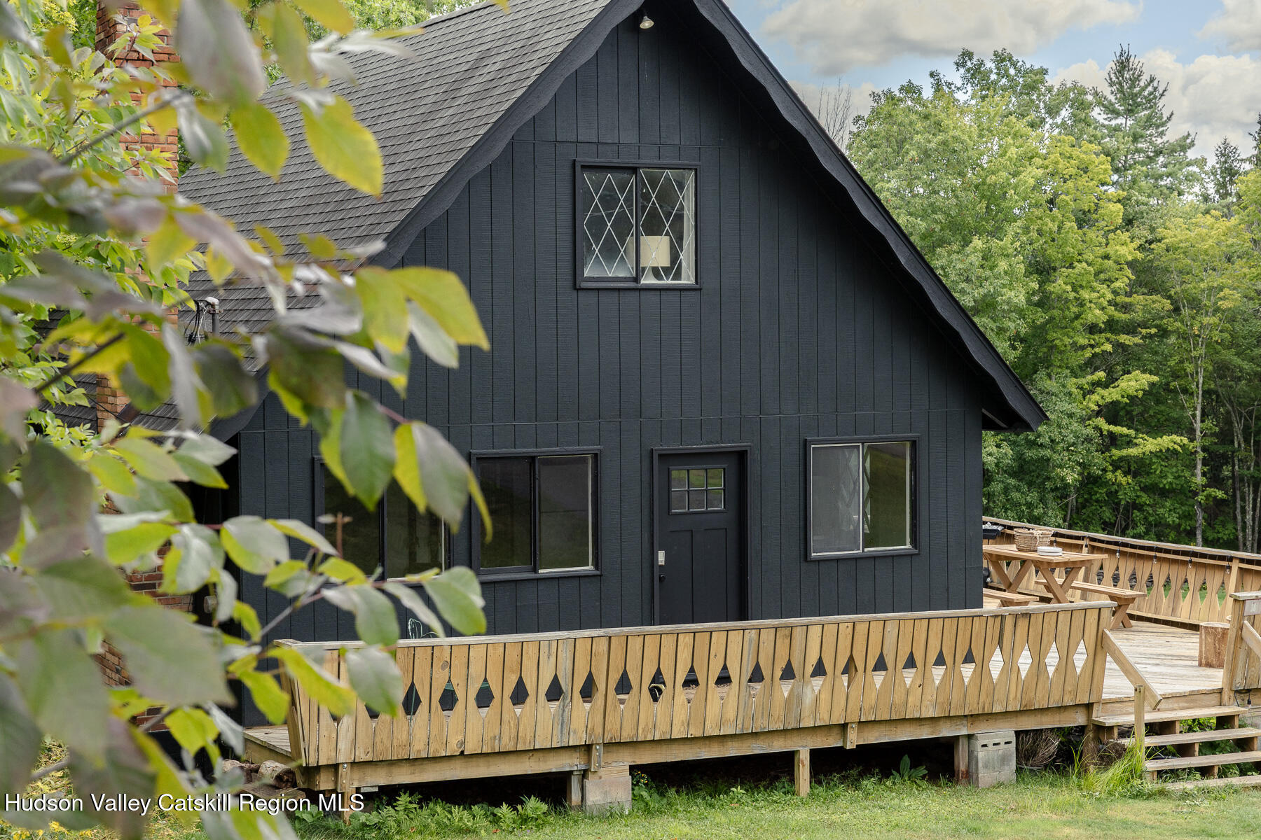 38 Cambridge Heights Road Windham, NY 12496 - Photo 29 of 29 a view of a house with wooden fence and a porch