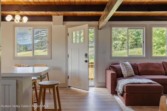 a living room with furniture and a window