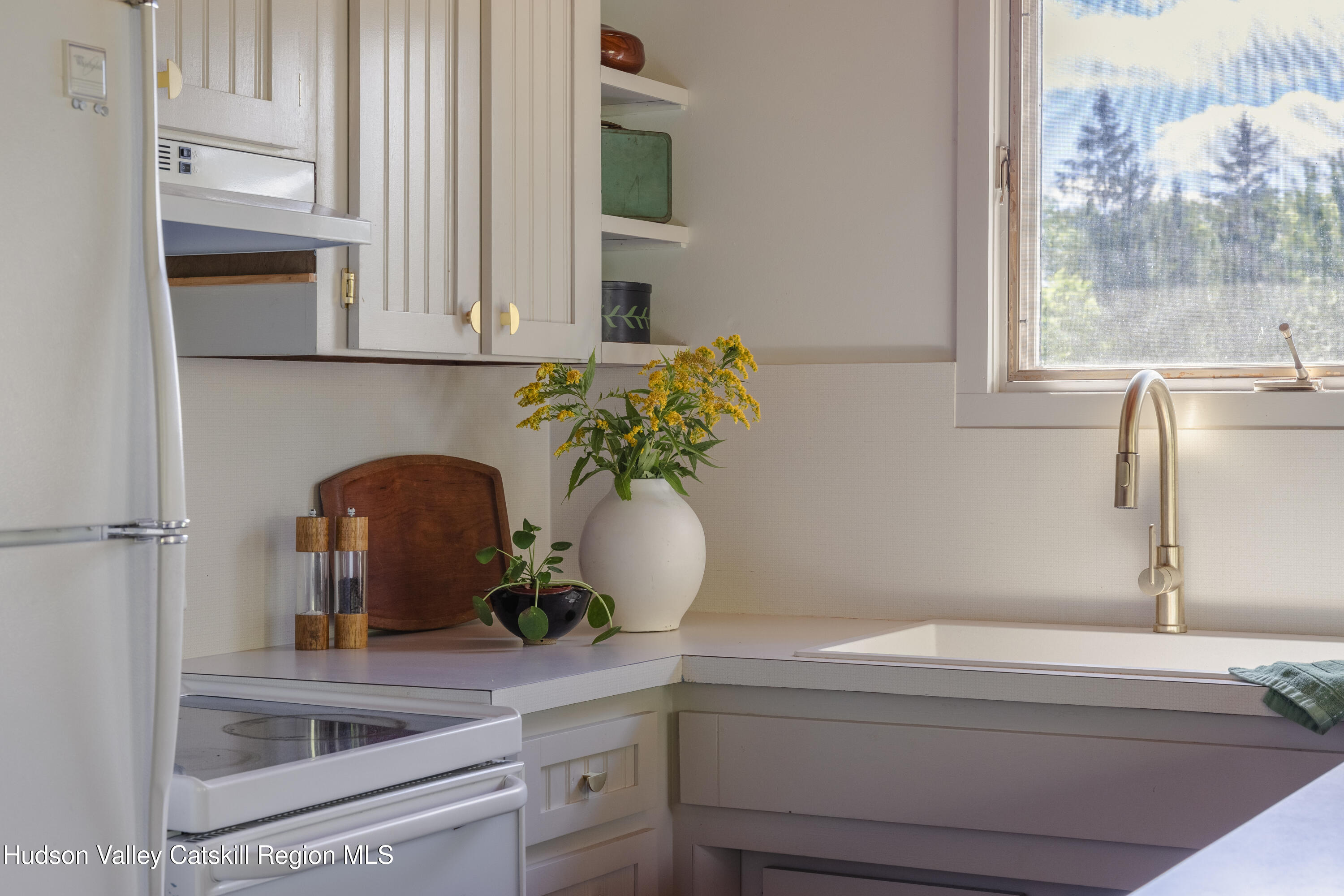 38 Cambridge Heights Road Windham, NY 12496 - Photo 7 of 29 a bathroom with a sink a potted plant and a window