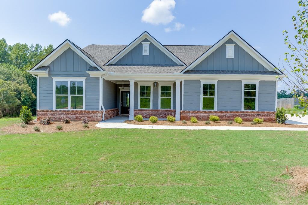 1123 Poppy Lane Jefferson, GA 30549 - Photo 2 of 45 front view of a house with a yard