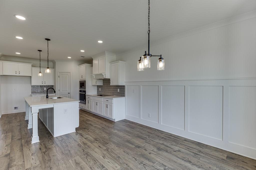 1123 Poppy Lane Jefferson, GA 30549 - Photo 22 of 45 a large kitchen with kitchen island a sink stainless steel appliances and cabinets