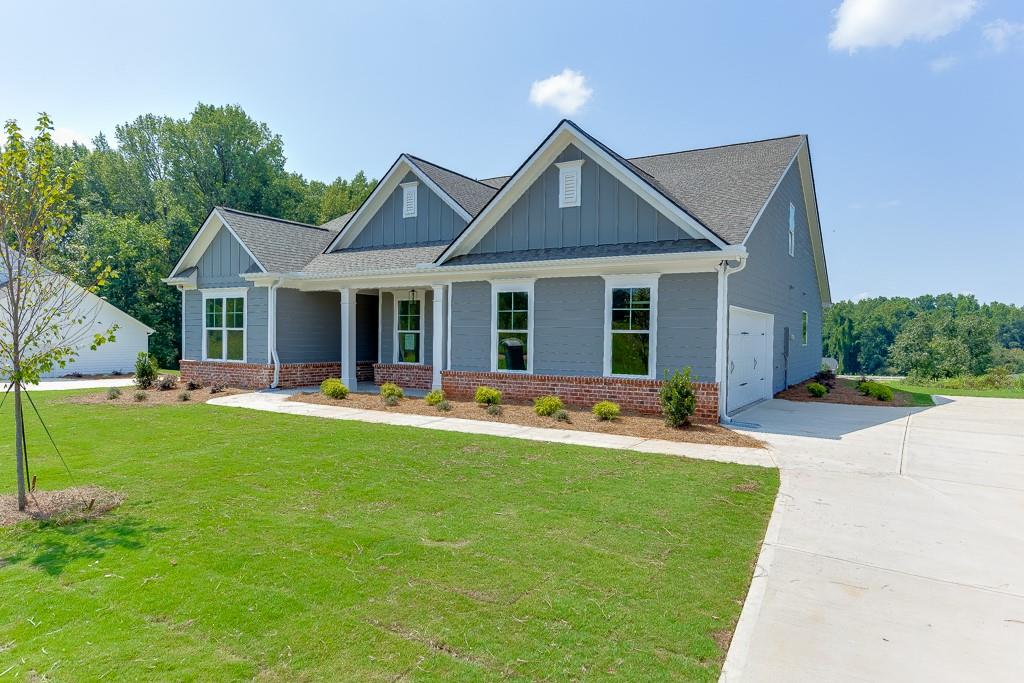 1123 Poppy Lane Jefferson, GA 30549 - Photo 3 of 45 a view of house that has a yard