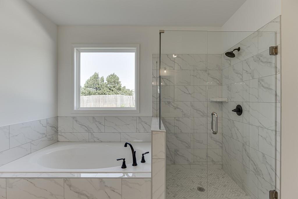 1123 Poppy Lane Jefferson, GA 30549 - Photo 32 of 45 a white bath tub sitting next to a window