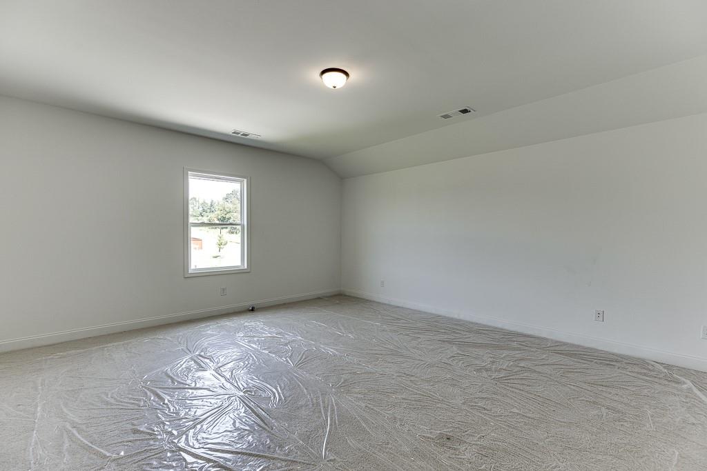 1123 Poppy Lane Jefferson, GA 30549 - Photo 38 of 45 an empty room with windows