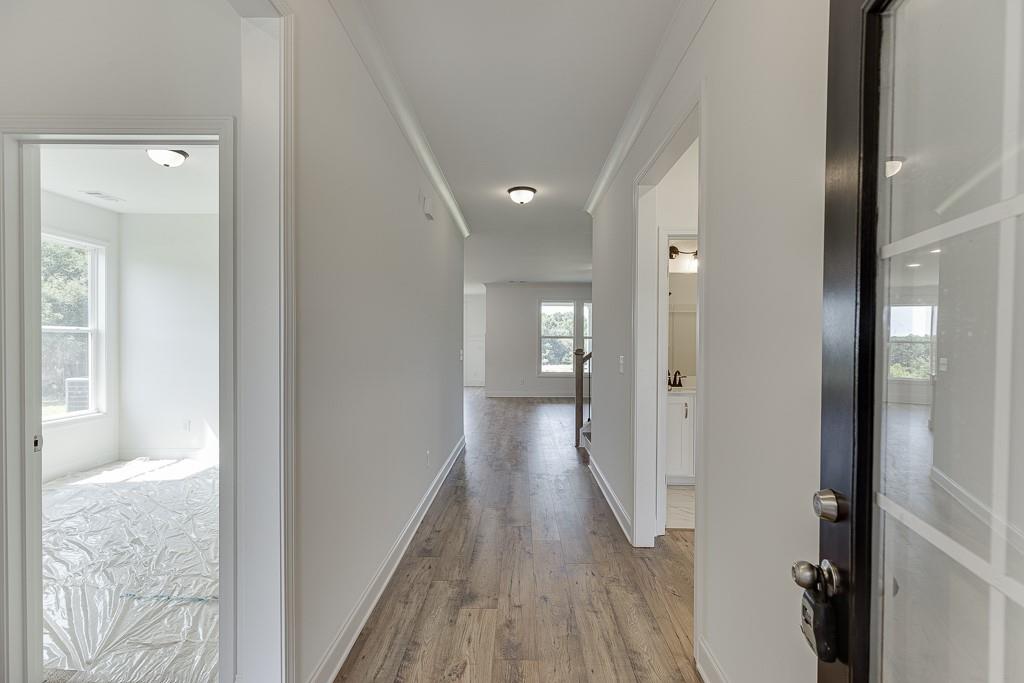 1123 Poppy Lane Jefferson, GA 30549 - Photo 4 of 45 a view of a hallway with wooden floor