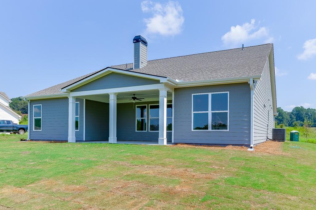 1123 Poppy Lane Jefferson, GA 30549 - Photo 44 of 45 a front view of a house with a garden