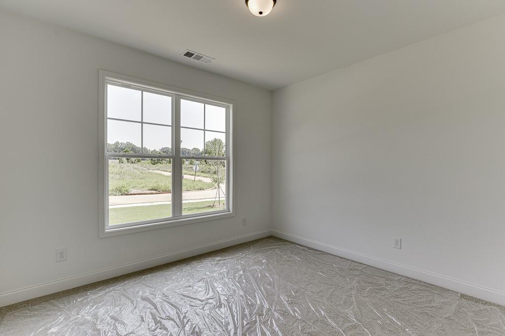 1123 Poppy Lane Jefferson, GA 30549 - Photo 5 of 45 a view of an empty room with a window