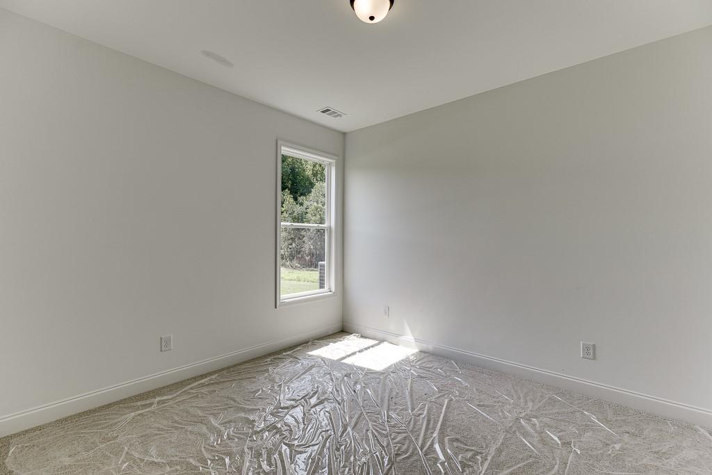 1123 Poppy Lane Jefferson, GA 30549 - Photo 9 of 45 a view of an empty room and window
