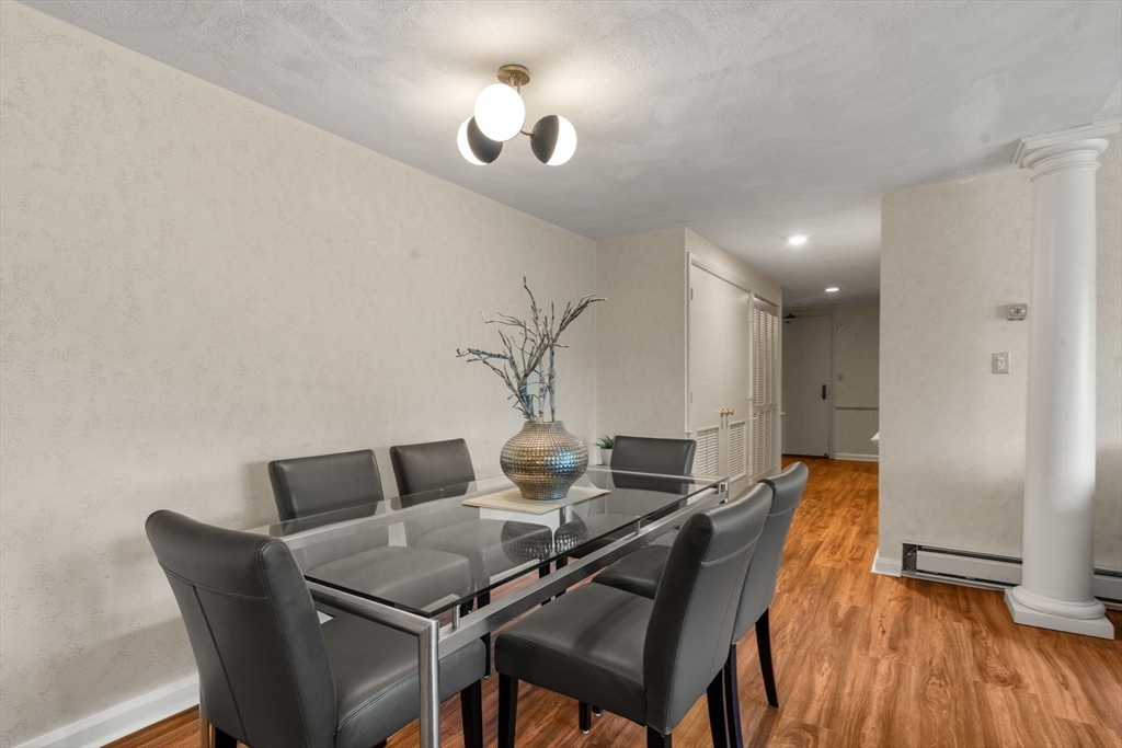75 Grove Street, Unit 227 Wellesley, MA 02482 - Photo 6 of 29 a workspace with furniture and wooden floor