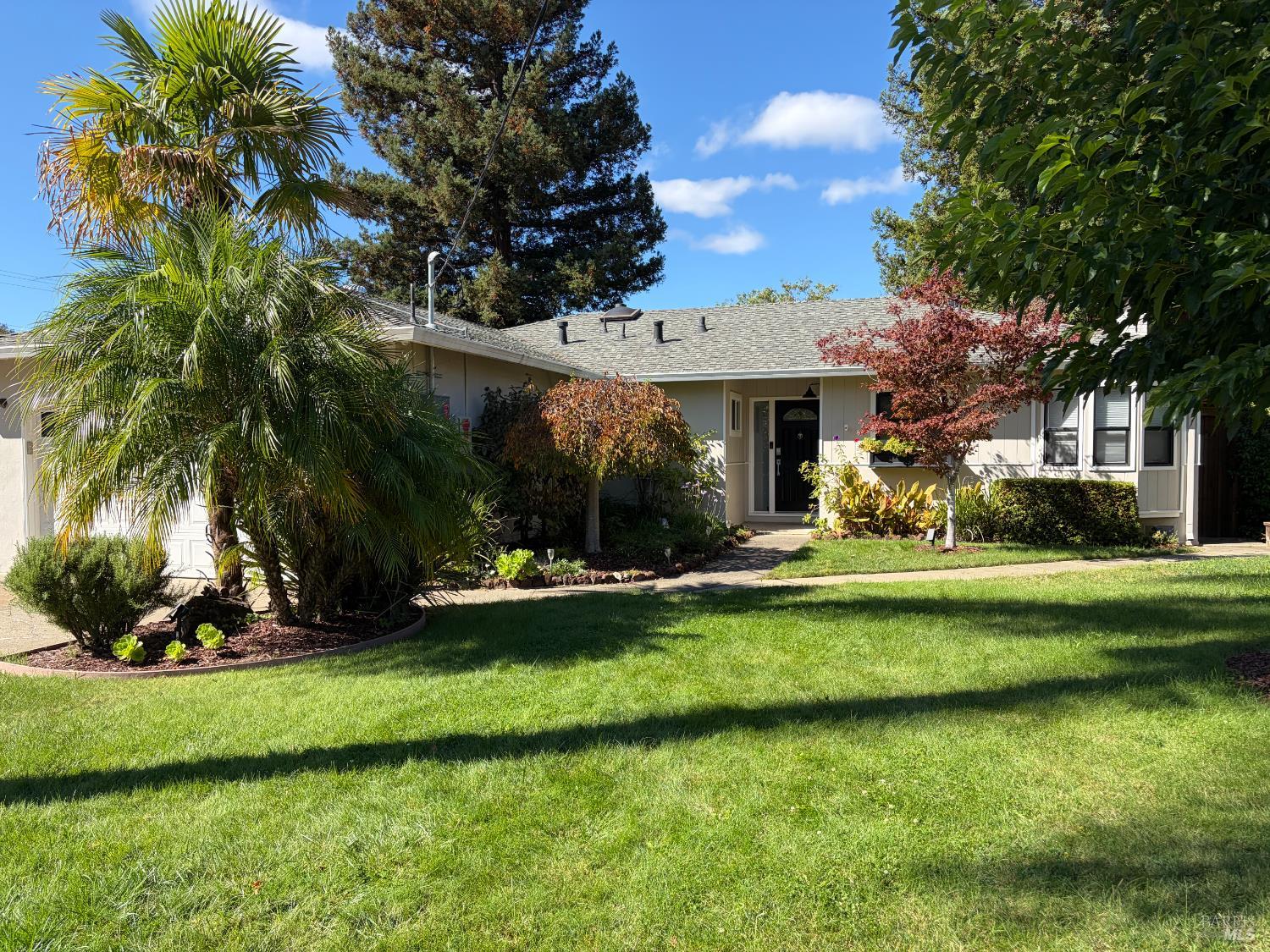 a view of a house with a yard porch and sitting area