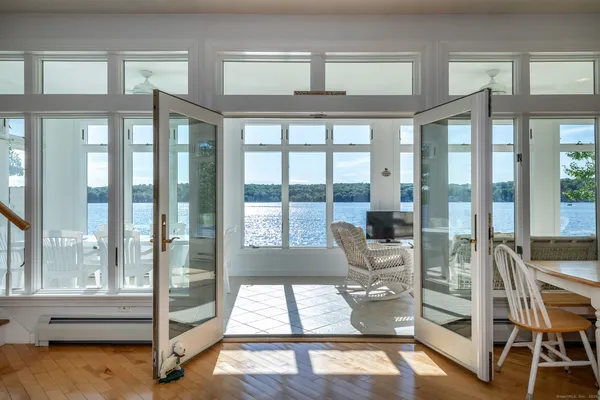 a living room with hardwood floor and windows