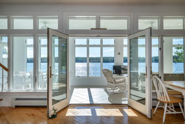 a living room with hardwood floor and windows