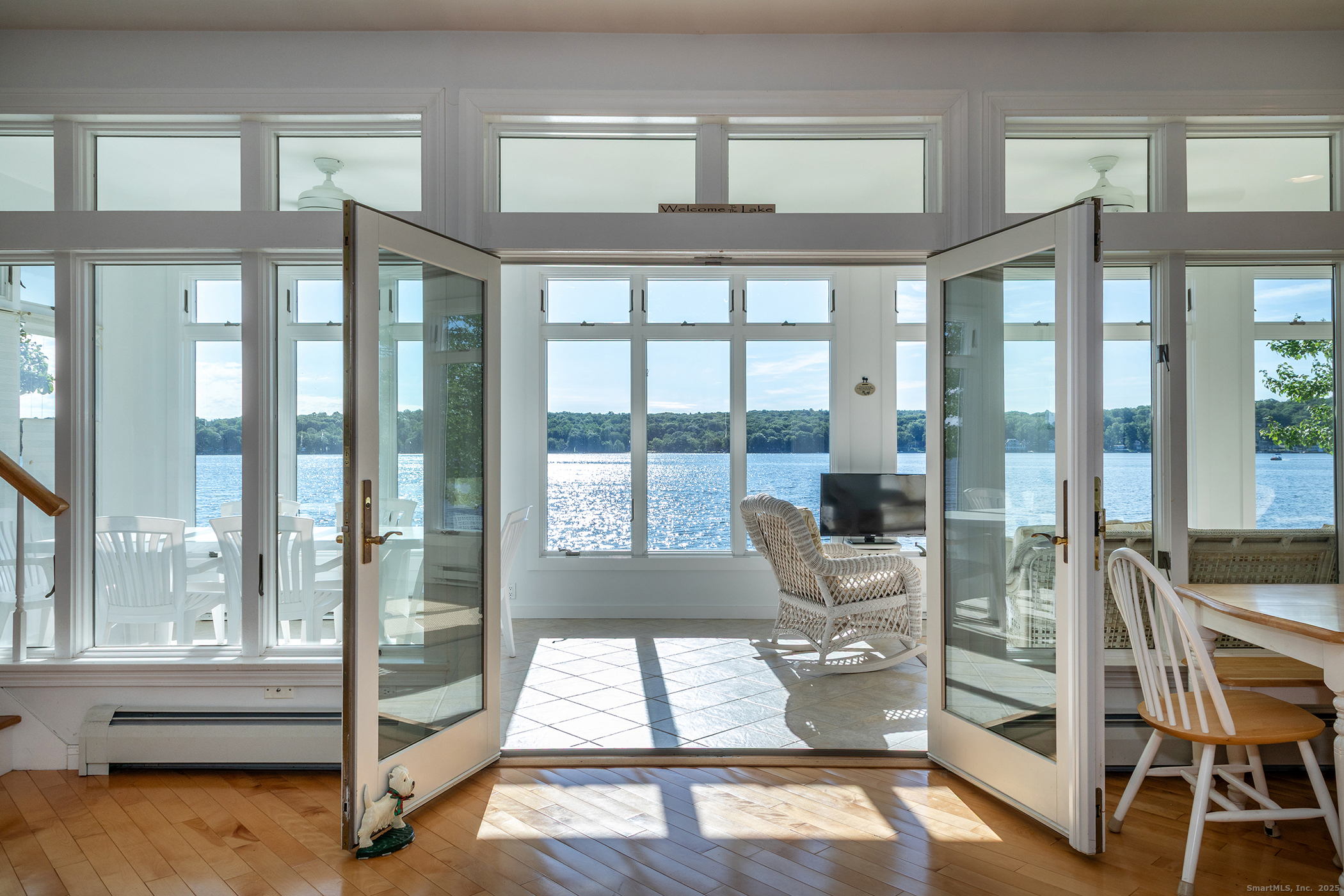 a living room with hardwood floor and windows