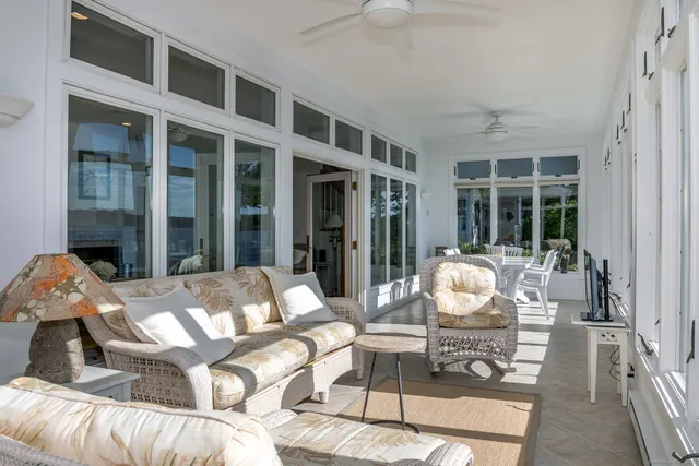 a view of balcony and dining area with furniture