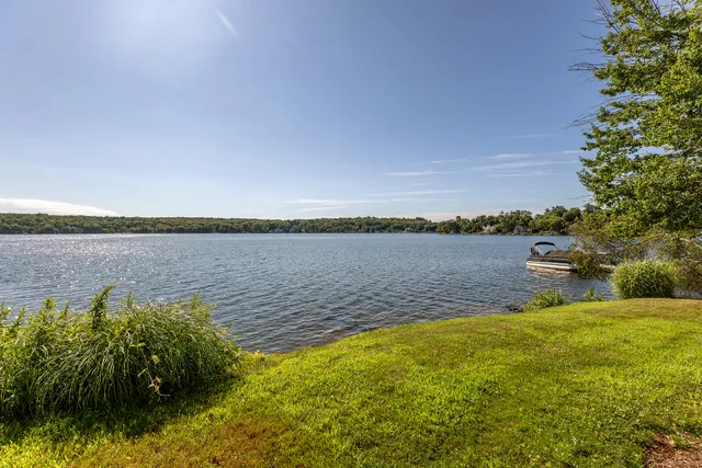 a view of a lake with houses in the back