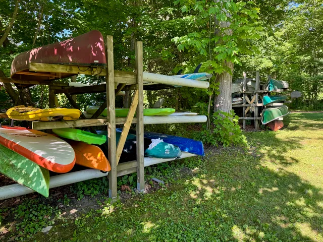 an outdoor sitting area with chairs and table