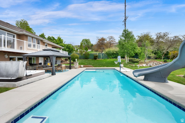 1506 Lakeview Drive Bountiful, UT 84010 - Photo 36 of 58 Swimming pool featuring a water slide, a patio, a gazebo, and an outdoor living space