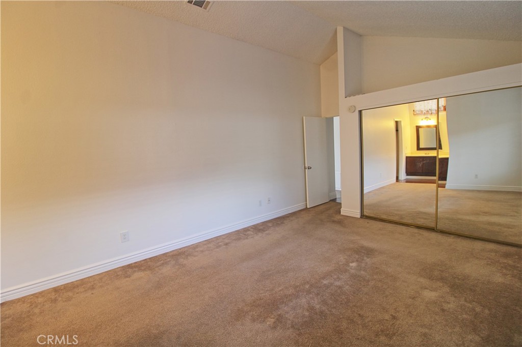 13597 Chaparral Trail Yucaipa, CA 92399 - Photo 7 of 12 an empty room with sliding door