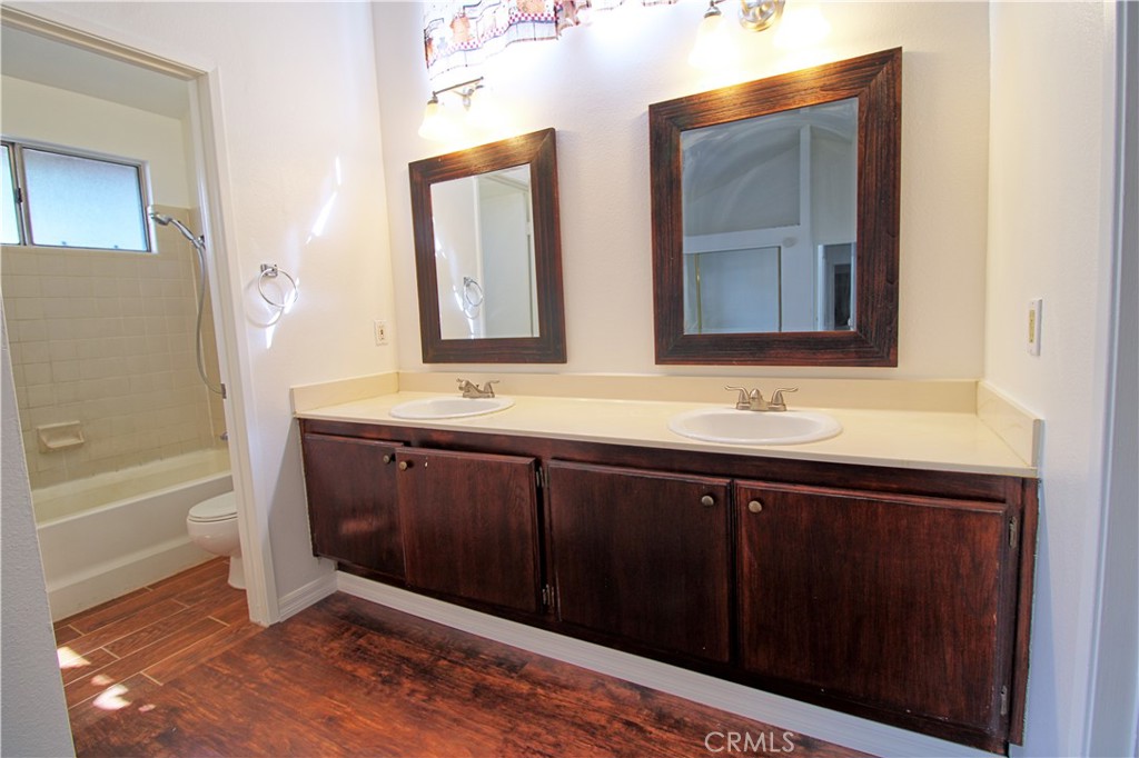 13597 Chaparral Trail Yucaipa, CA 92399 - Photo 8 of 12 a bathroom with a sink and a mirror