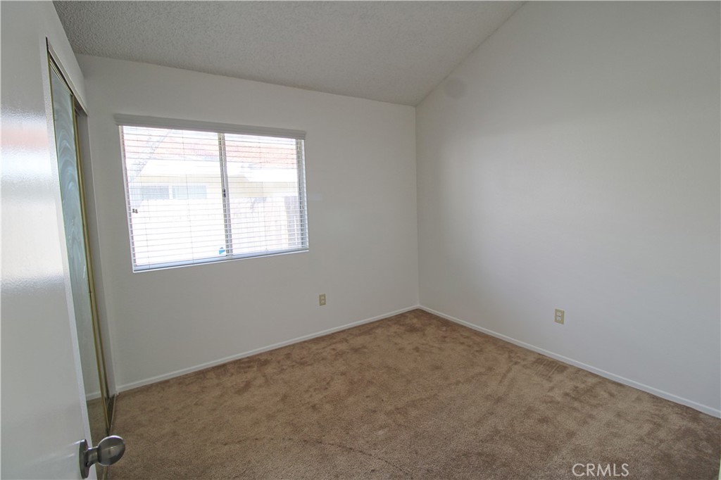 13597 Chaparral Trail Yucaipa, CA 92399 - Photo 9 of 12 an empty room with a window