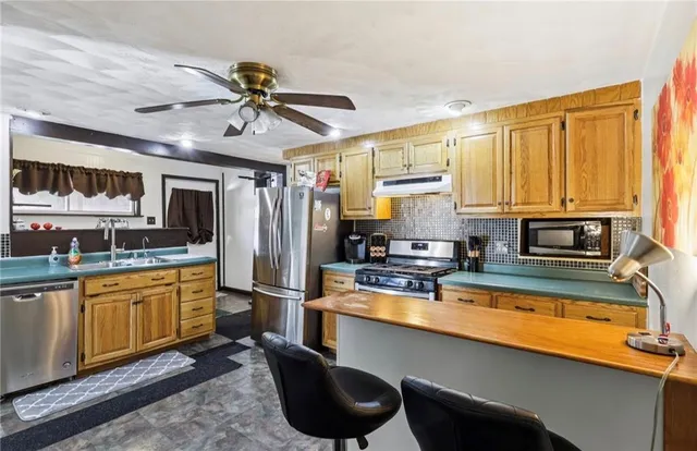 a bedroom with a bed and a large window with outer view