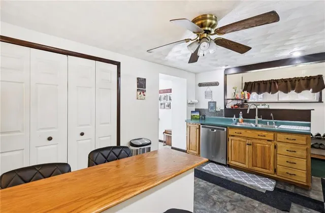 a kitchen with sink and window