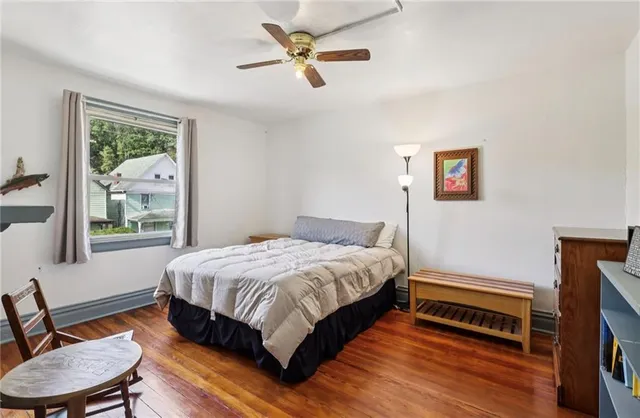 a bedroom with a bed and a fireplace