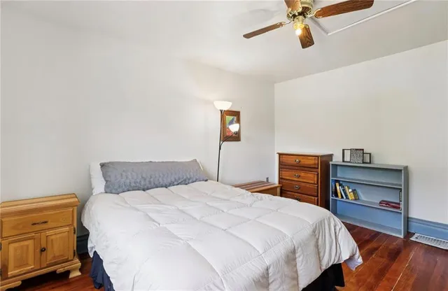 a bedroom with a bed and a fireplace