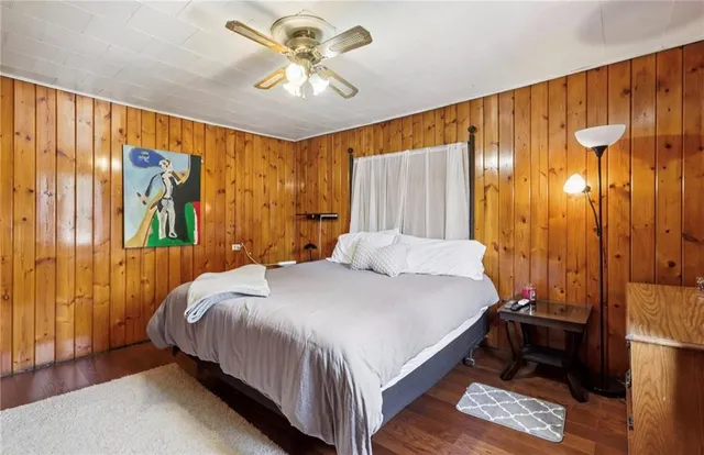 a bedroom with a bed and a cabinet