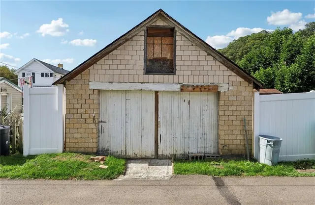a picture of a cabinet with a white wall and white paint